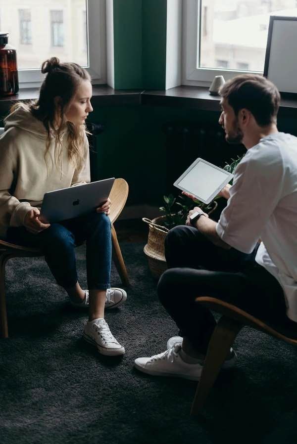 Two people working through an agreement