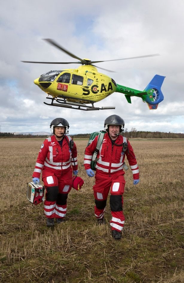 Emergency crew walking back from the field